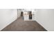 Finished basement area with wet bar, stairs, and plush carpeting at 5103 Quitman St, Denver, CO 80212