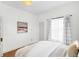 Bright bedroom with fresh decor, natural light, and a cozy ambiance perfect for restful nights and relaxation at 5103 Quitman St, Denver, CO 80212