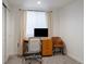 Well-lit home office with a large window, neutral tones and ample desk space at 5103 Quitman St, Denver, CO 80212