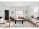 Cozy living room with hardwood floors, neutral tones, and a modern aesthetic at 5103 Quitman St, Denver, CO 80212