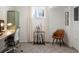 Study area features a desk, guitar stand, neutral curtains, and a chair at 5103 Quitman St, Denver, CO 80212