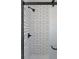 Shower with white subway tile, black trim, and a glass door at 5103 Quitman St, Denver, CO 80212