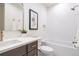 Well-appointed bathroom with integrated tub, stand-alone sink, and luxury fixtures at 1120 S Gaylord St, Denver, CO 80210