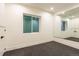 Versatile bonus room with wall-to-wall mirrors and carpeted floor at 1120 S Gaylord St, Denver, CO 80210