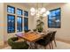 Contemporary dining room showcasing a wooden table, modern chairs, and elegant lighting fixtures at 1120 S Gaylord St, Denver, CO 80210