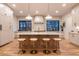 Modern kitchen island with quartz countertop, stylish seating, and pendant lighting at 1120 S Gaylord St, Denver, CO 80210