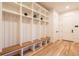 Well-organized mudroom with built-in storage cubbies, wooden bench, and access to the main house at 1120 S Gaylord St, Denver, CO 80210