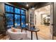 Cozy home office with view into adjacent dining room, highlighting natural light and elegant furnishings at 1120 S Gaylord St, Denver, CO 80210