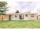 Lush backyard featuring a patio with comfortable seating, perfect for outdoor entertaining at 3890 Moore St, Wheat Ridge, CO 80033