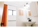 Bright bathroom with a white sink, walk-in shower, and modern black fixtures, highlighted with a colorful curtain at 3890 Moore St, Wheat Ridge, CO 80033