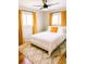 Cozy bedroom with plush rug, bright curtains, and natural light at 3890 Moore St, Wheat Ridge, CO 80033