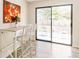 Sunny dining area with patio access through sliding glass doors at 3890 Moore St, Wheat Ridge, CO 80033