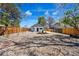 Large backyard featuring gravel landscaping, new wooden fence, and a central planting area at 4745 N Clay St, Denver, CO 80211