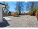 A big open backyard featuring rock landscaping with a border and a wood fence at 4745 N Clay St, Denver, CO 80211