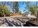 Expansive backyard features rock landscaping, mature trees, and a new fence, creating a serene outdoor retreat at 4745 N Clay St, Denver, CO 80211