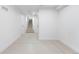 Finished basement area with light colored flooring, leading to the stairs at 4745 N Clay St, Denver, CO 80211