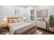 Bright bedroom with a comfortable bed, stylish decor, and natural light from the windows at 4745 N Clay St, Denver, CO 80211