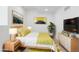 Bright bedroom featuring stylish decor, modern furnishings, and a comfortable queen-sized bed with vibrant green accents at 4745 N Clay St, Denver, CO 80211
