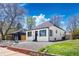 Beautifully renovated home showcasing manicured, low-maintenance front yard with gravel landscaping and a freshly painted exterior at 4745 N Clay St, Denver, CO 80211