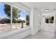 Hallway with white brick and large windows showing the neighborhood at 4745 N Clay St, Denver, CO 80211