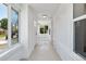 Bright hallway featuring white walls and ceilings and large windows, offering ample natural light at 4745 N Clay St, Denver, CO 80211