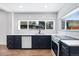 Modern kitchen boasts white subway tile backsplash, quartz countertops and a large window at 4745 N Clay St, Denver, CO 80211
