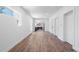 Hardwood floors lead to a crisp, white living space with direct access to a modern kitchen at 4745 N Clay St, Denver, CO 80211