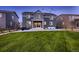 Beautifully landscaped backyard featuring green lawn and patio, perfect for outdoor entertaining at 38 Morgan Cir, Erie, CO 80516