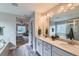 A spa-like bathroom featuring double sinks, quartz counters, and a separate bathtub and shower for relaxation at 38 Morgan Cir, Erie, CO 80516