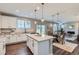 Bright, airy kitchen with a center island, stainless steel appliances, and modern finishes at 38 Morgan Cir, Erie, CO 80516