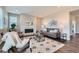 Cozy living room with a stone fireplace, neutral décor, and ample natural light at 38 Morgan Cir, Erie, CO 80516