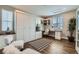 This office features a modern built-in desk, cabinets, and a stylish Murphy bed for versatile use and convenience at 38 Morgan Cir, Erie, CO 80516