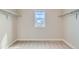 Spacious walk-in closet with a window and hanging rods, offering ample storage and organization at 38 Morgan Cir, Erie, CO 80516