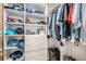 Walk-in closet with built-in shelving and ample storage for clothes and accessories at 9640 Moss Rose Cir, Highlands Ranch, CO 80129