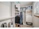 Walk-in closet with custom shelving, drawers, and storage solutions for organization at 9640 Moss Rose Cir, Highlands Ranch, CO 80129