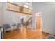 Spacious living area featuring hardwood floors, a vaulted ceiling, and an open staircase to the loft at 9640 Moss Rose Cir, Highlands Ranch, CO 80129