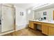 Bright bathroom featuring a separate shower and tub, as well as a double sink vanity at 11386 Eaton Way, Westminster, CO 80020