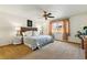 Comfortable main bedroom featuring a ceiling fan and plush carpet for a cozy and inviting atmosphere at 11386 Eaton Way, Westminster, CO 80020