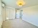 Bright bedroom with double doors leading to another room and carpet flooring at 1931 S Locust St, Denver, CO 80224