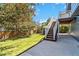 Spacious, landscaped backyard featuring a covered patio and verdant lawn at 9546 High Cliffe St, Highlands Ranch, CO 80129