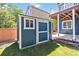Charming backyard shed with a window and matching trim on a well manicured lawn at 9546 High Cliffe St, Highlands Ranch, CO 80129