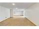 Finished basement space with carpet and a sliding glass door at 9546 High Cliffe St, Highlands Ranch, CO 80129