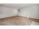 Finished basement with neutral carpet and a window at 9546 High Cliffe St, Highlands Ranch, CO 80129