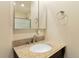 Bathroom featuring granite countertop, bowl sink, and mirrored cabinet at 9546 High Cliffe St, Highlands Ranch, CO 80129