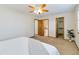 Spacious bedroom with closet and bathroom access, featuring neutral walls and carpet at 9546 High Cliffe St, Highlands Ranch, CO 80129