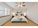 Inviting bedroom featuring a ceiling fan, neutral tones, and plantation shutters at 9546 High Cliffe St, Highlands Ranch, CO 80129