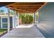 Covered patio area featuring a concrete floor and a shed on a lush lot at 9546 High Cliffe St, Highlands Ranch, CO 80129