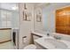 Laundry room featuring updated washer and dryer and marble countertops at 9546 High Cliffe St, Highlands Ranch, CO 80129
