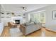 Cozy living room with a fireplace, built-in shelves, and a comfortable seating area at 9546 High Cliffe St, Highlands Ranch, CO 80129