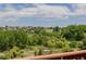 Scenic backyard view from the deck, showcasing a golf course and lush greenery at 3126 Aspen Creek Dr, Highlands Ranch, CO 80129